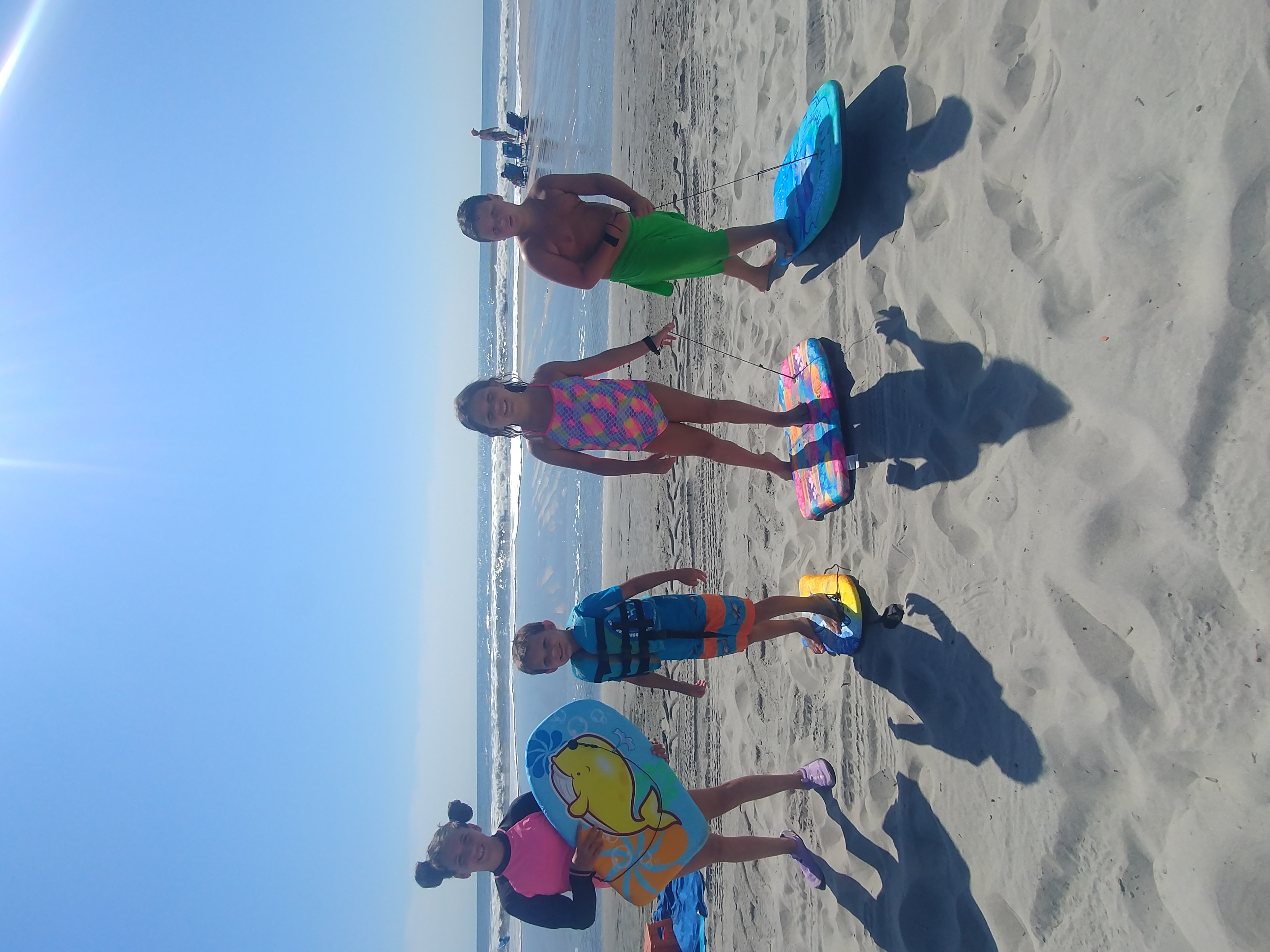 My kids and nice and nephew on the beach ready to ...