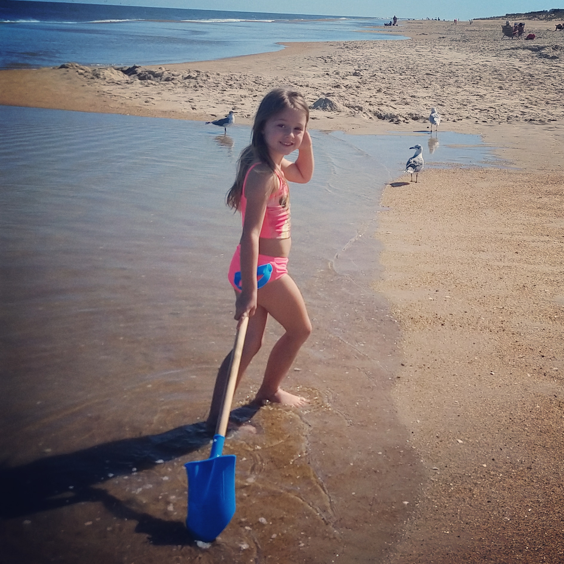 Lydia exploring Fenwick Island Beach...