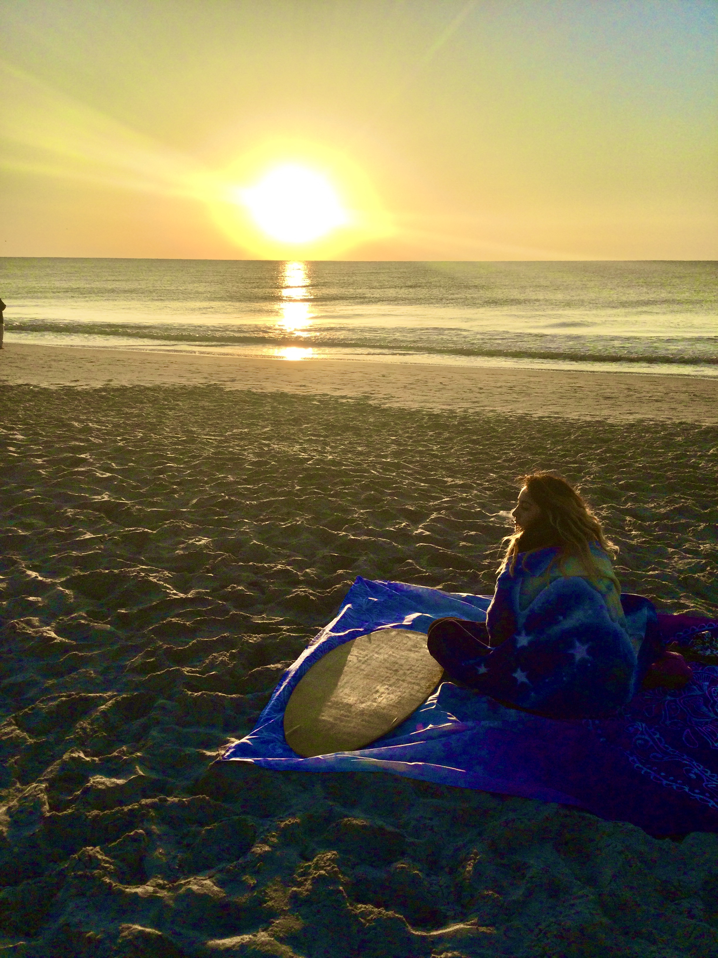 My granddaughter watching a brisk morning sunrise...