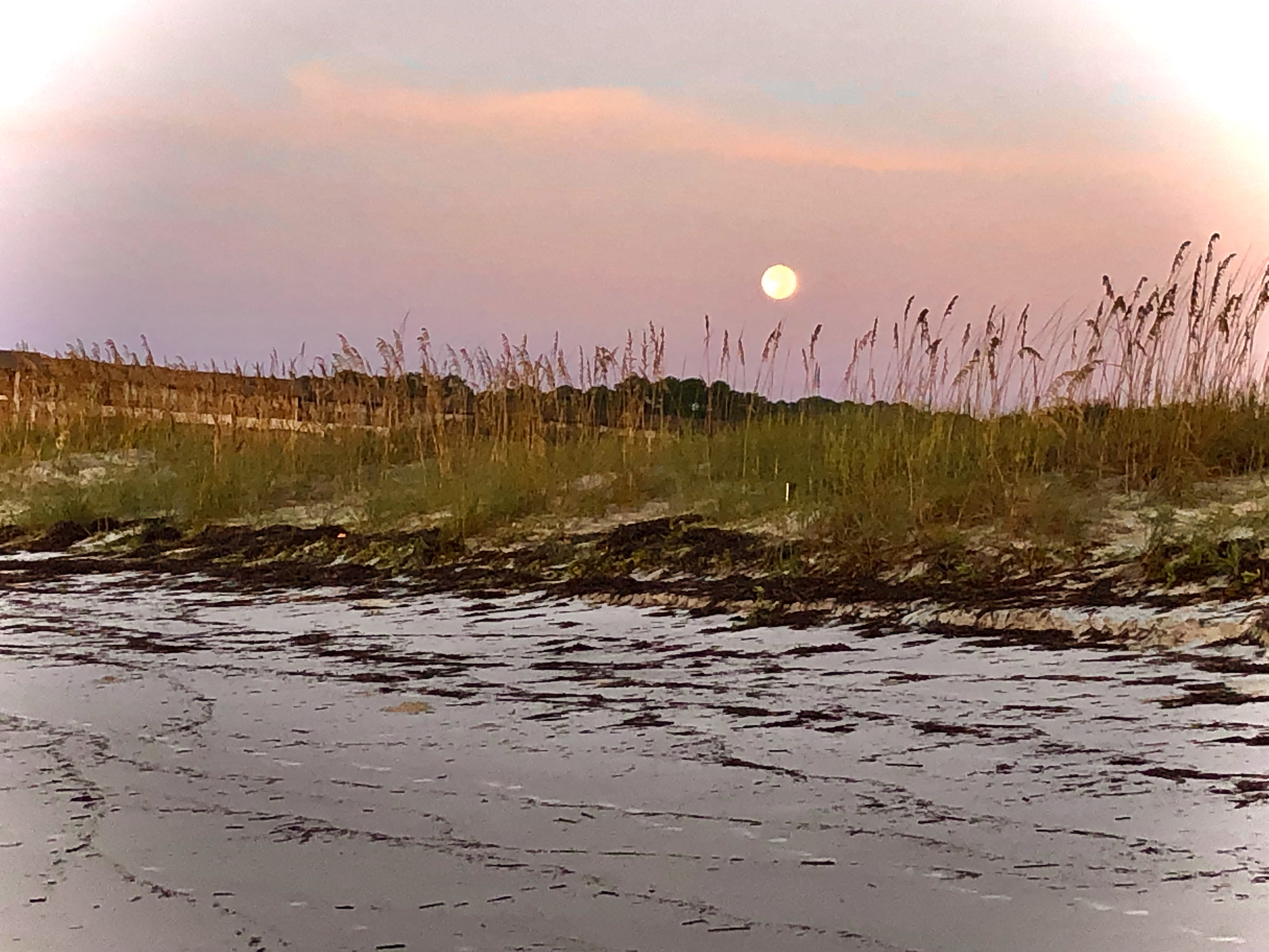 Moon setting morning after Idalia hurricane storm Hilton Head