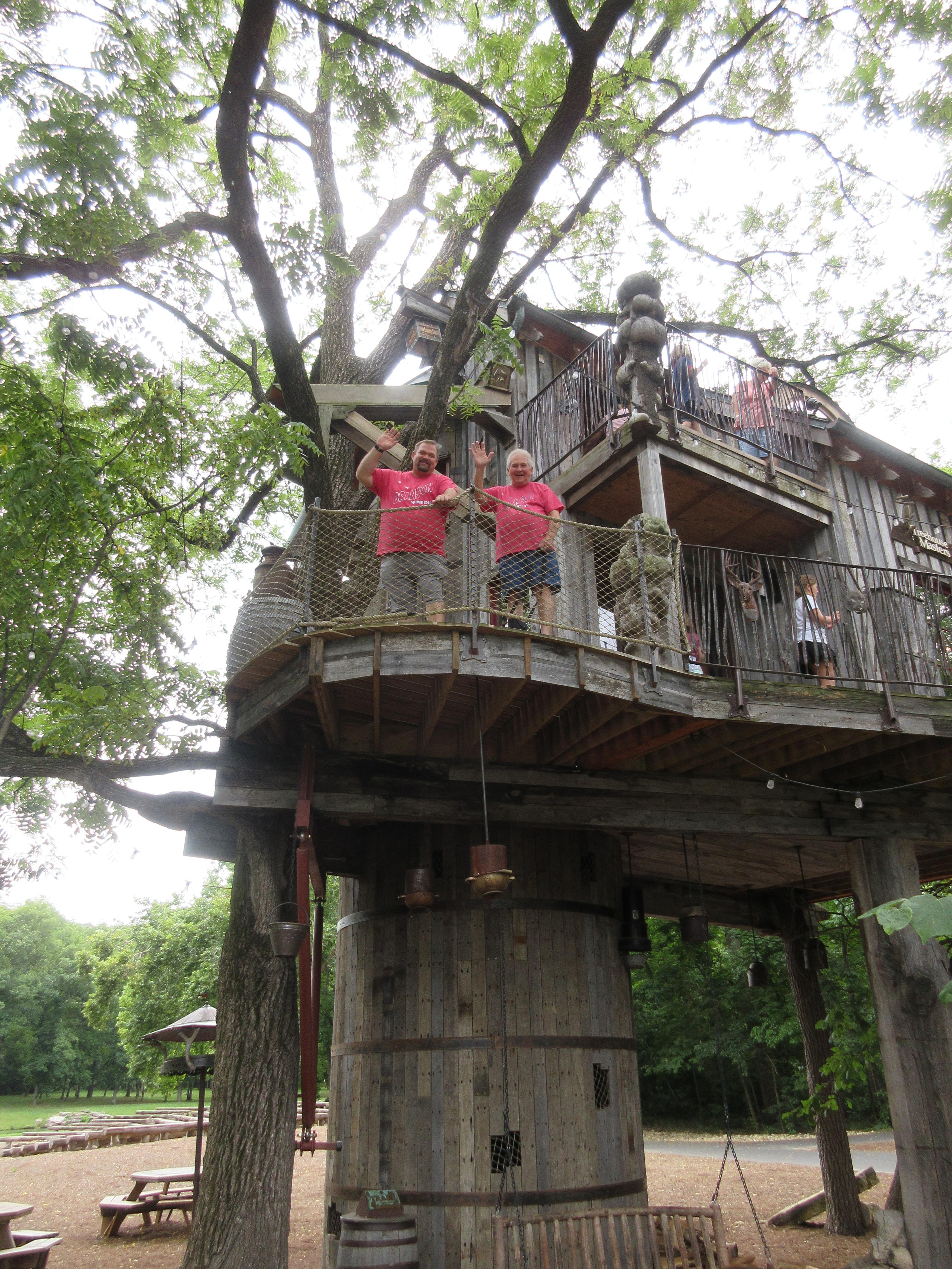 Father and son playing in the treehouse at Dogwood...